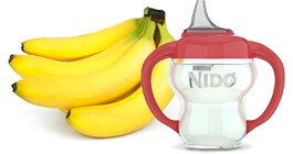 Plátanos junto a un sippy cup de NIDO.